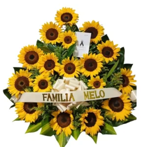 Corona fúnebre con girasoles para entrega urgente en funerarias de Cali